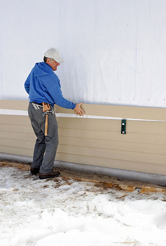 seamless siding installation enhancing home's curb appeal and protection